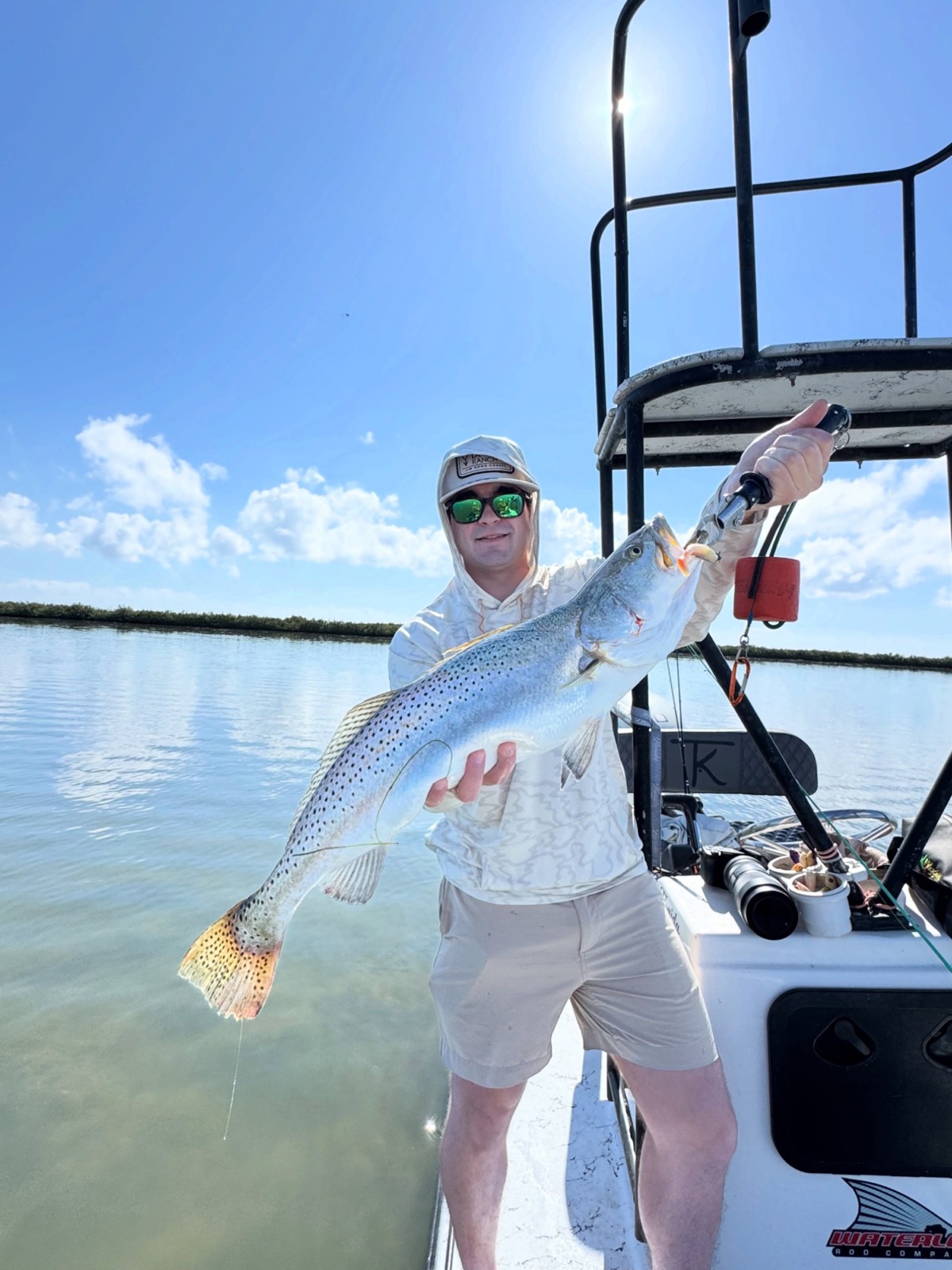 Big speckled trout held up beside the tower