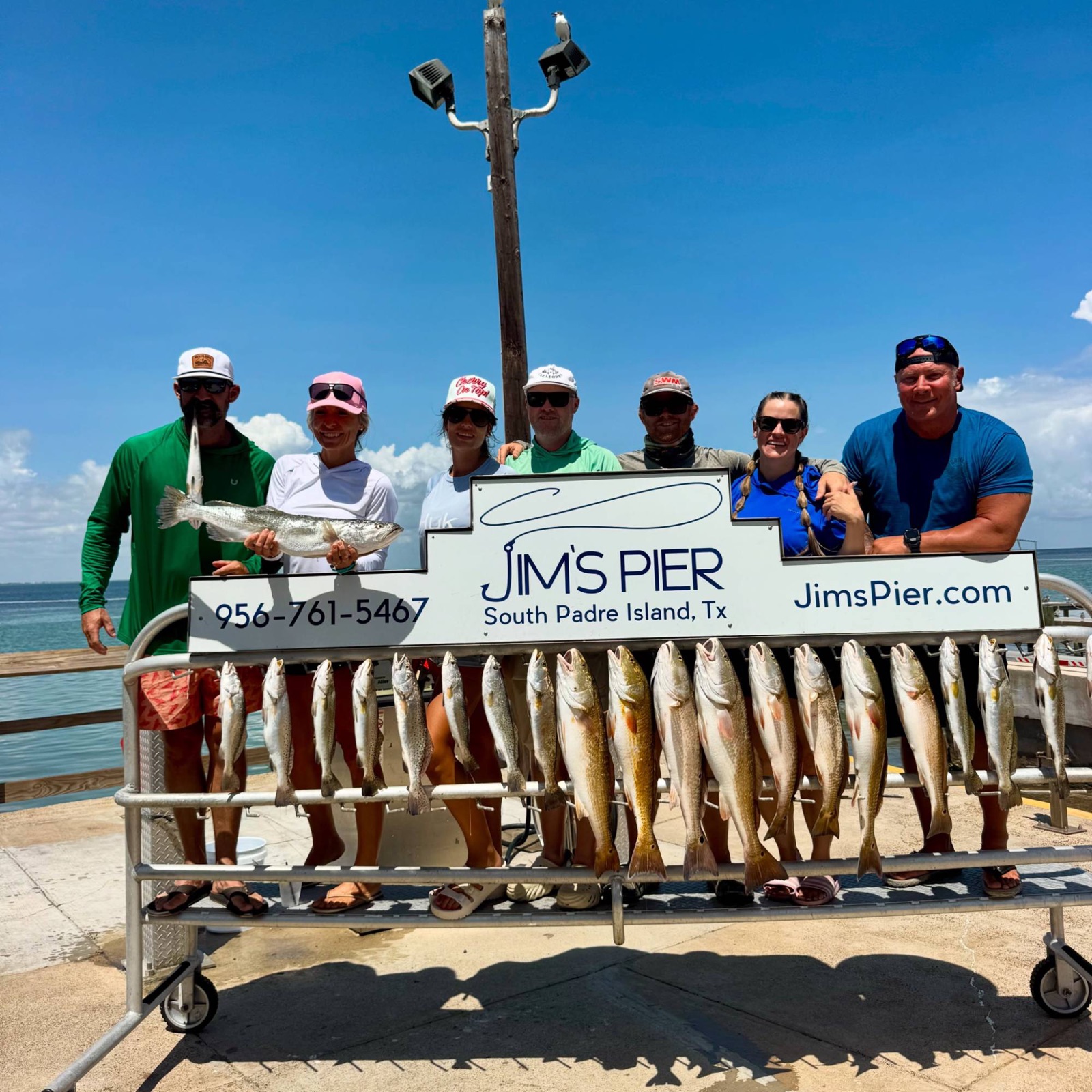 Group with a full stringer of trout and redfish at Jim's Pier, South Padre Island