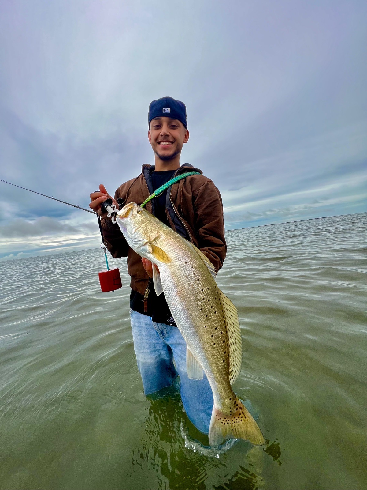 Angler wading the flats with a speckled trout