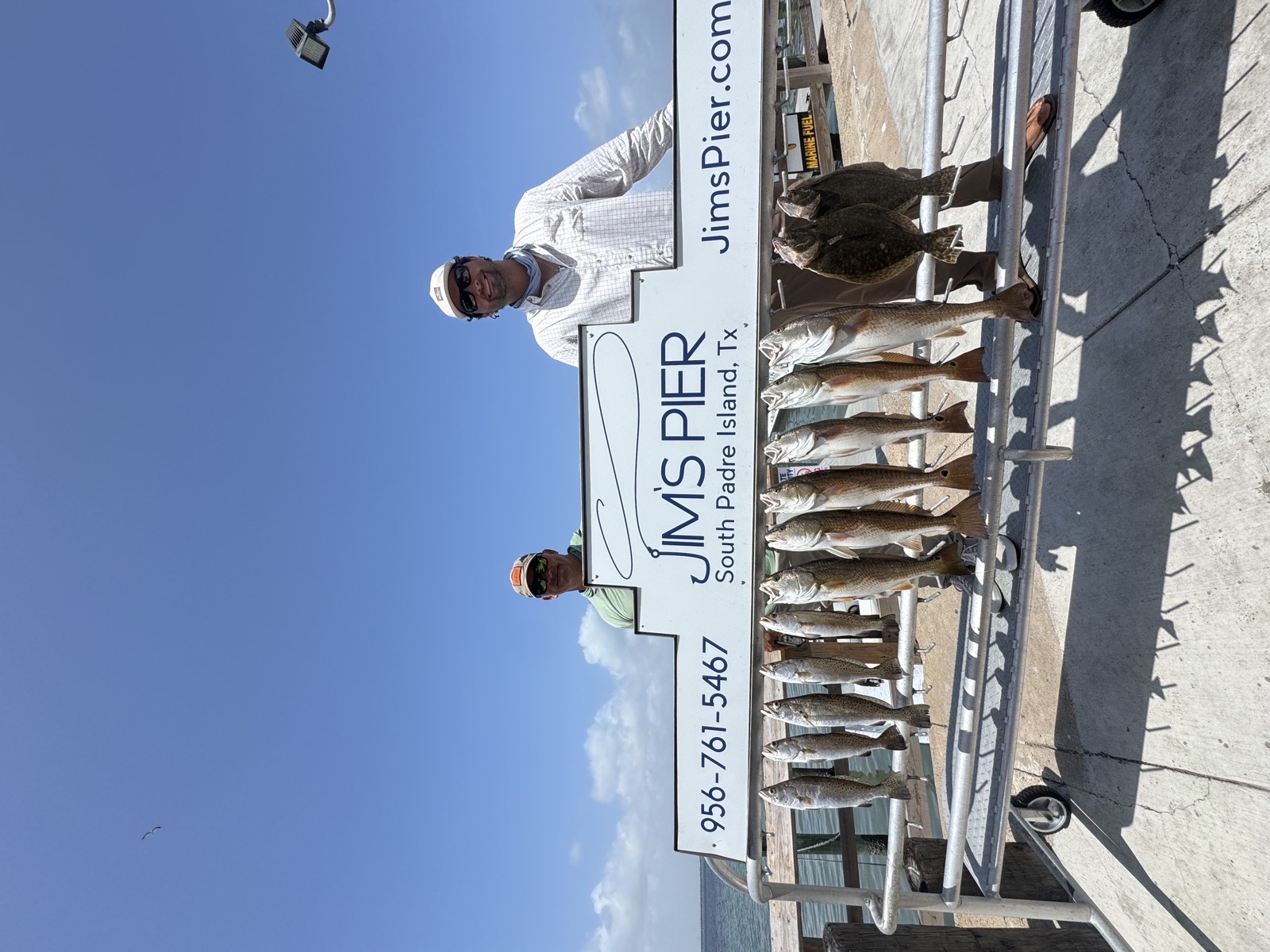 Anglers with a stringer of fish at Jim's Pier, South Padre Island