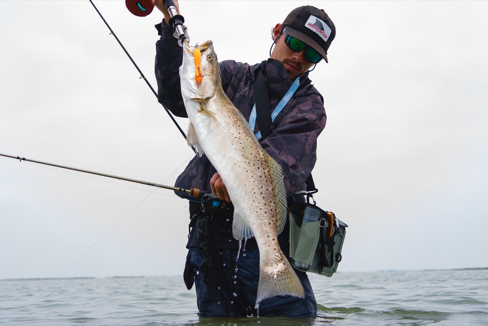 Capt. Trevor Kucia wading with a big speckled trout