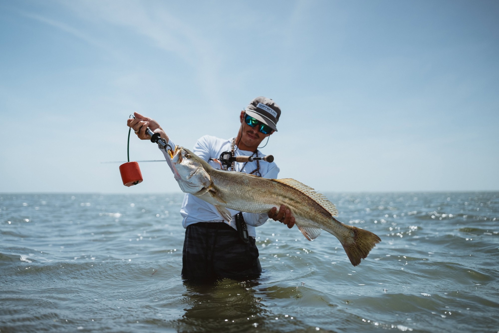Capt. Trevor Kucia wading the flats with a big speckled trout